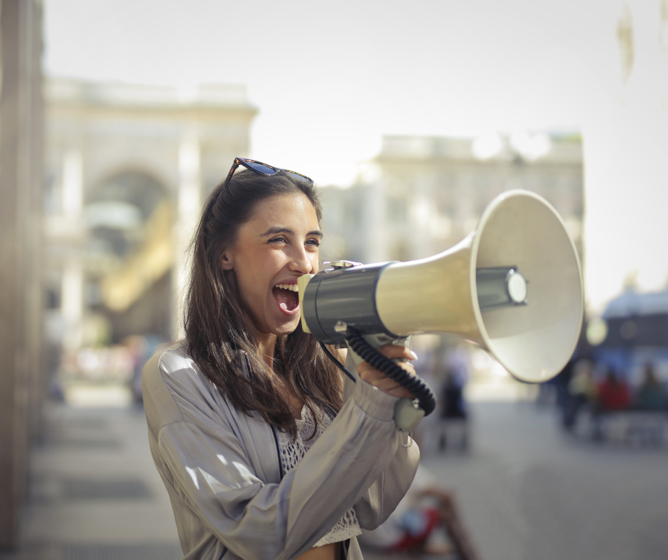 woman using megaphone (establishing rapport using PlatoForms online PDF tool)